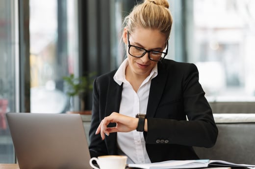 cheerful-business-woman-looking-watch (1)